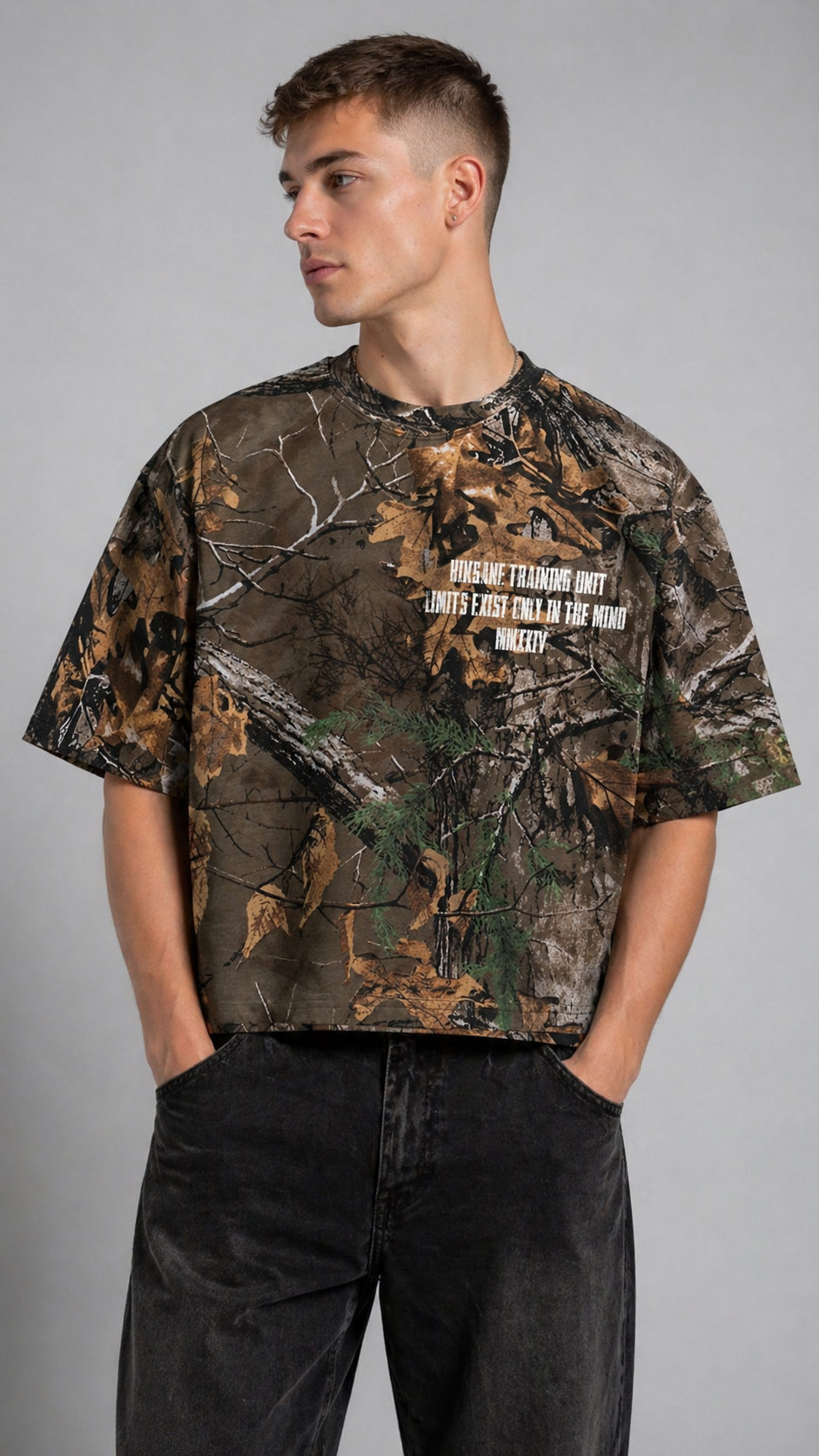 Camouflage t shirt with white text reading “KINSANE TRAINING UNIT LIMITS EXIST ONLY IN THE MIND MMXXIV” 