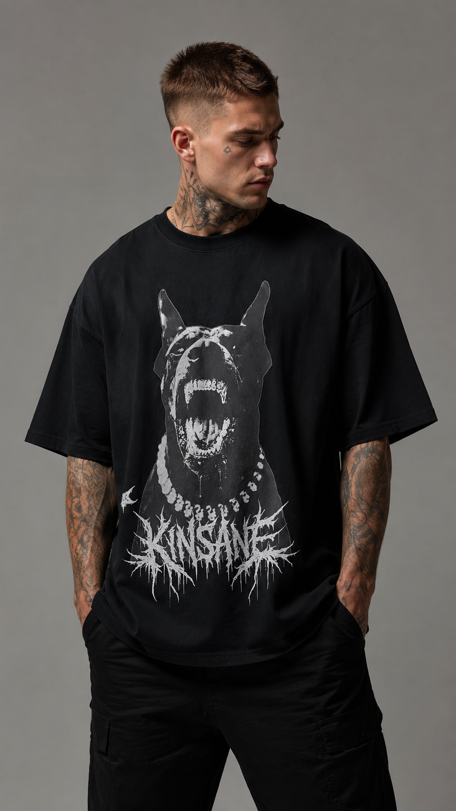 Man wearing Black t shirt with Doberman dog design and white text reading “KINSANE” 