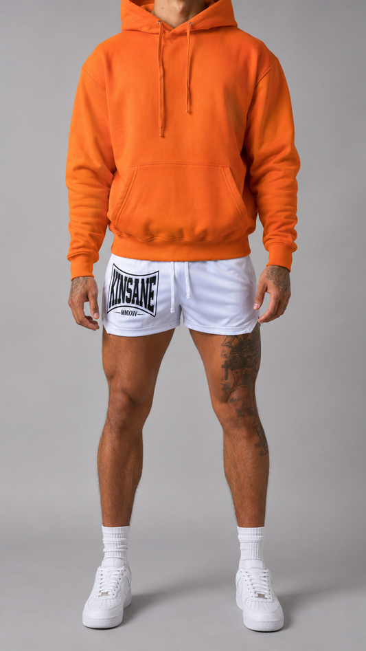 Man wearing White athletic shorts with white drawstrings and a black logo on the left side with text reading “KINSANE MMXXIV” 
