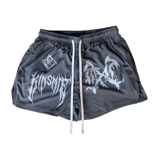 Gray athletic shorts with white drawstrings and a white logo on the right side and a white logo and white text reading “KINSANE” on the left side 