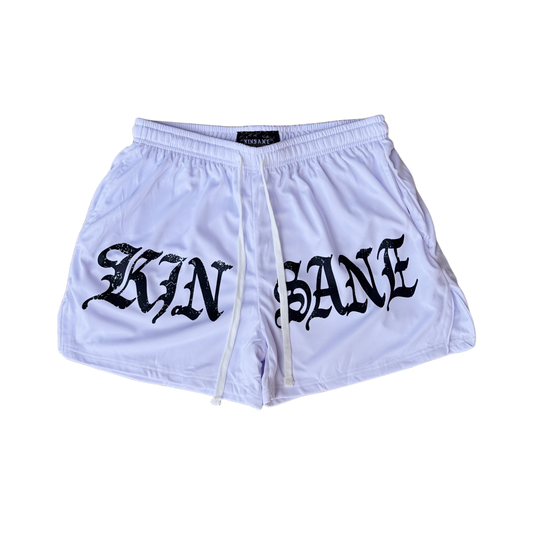 White athletic shorts with white drawstrings and black lettering reading “KINSANE” on the front 