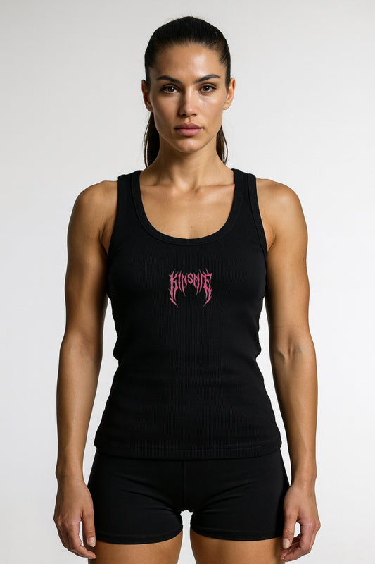Girl wearing black tank top with pink tribal lettering reading “KINSANE” 