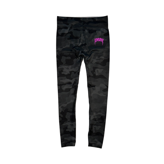 Black and grey camo compression leggings with pink heavy metal lettering reading “KINSANE” on the right leg 