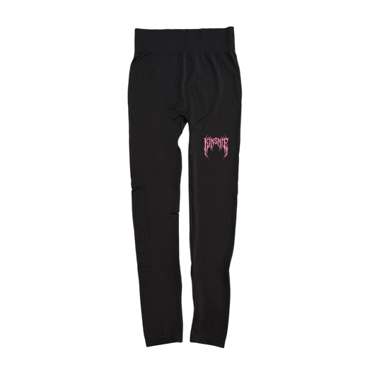 Black compression leggings with pink tribal lettering reading “KINSANE” on the right leg 