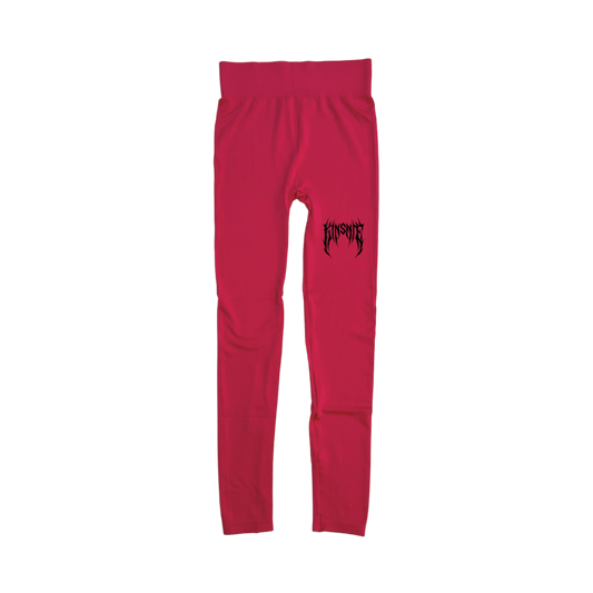 Pink compression leggings with a black tribal lettering reading “KINSANE” on the right leg 
