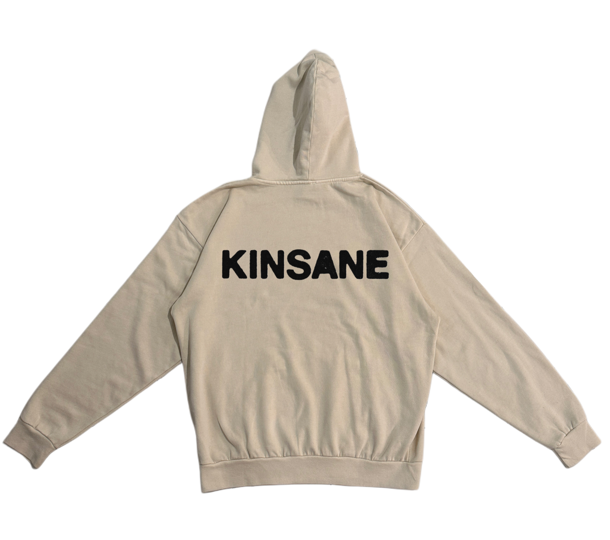 Back view of a beige hoodie with black text reading “KINSANE” 