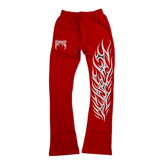 red stacked sweatpants with white tribal lettering reading “KINSANE” on the left side and white tribal flames on the right side 