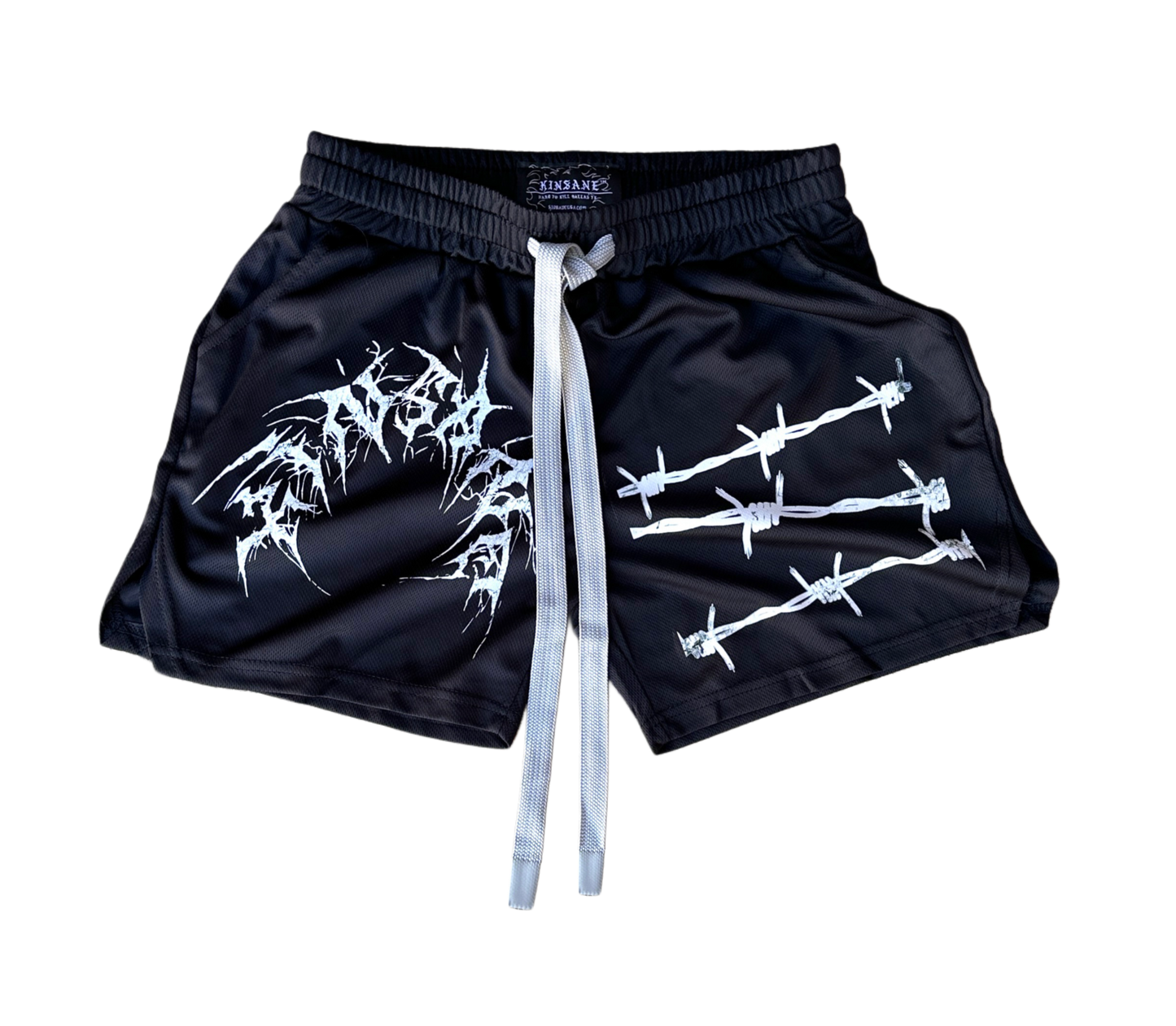Black athletic shorts with elastic waistband and gray drawstrings and white tribal lettering reading “KINSANE” on the right leg and white barbed wire design on the left leg 