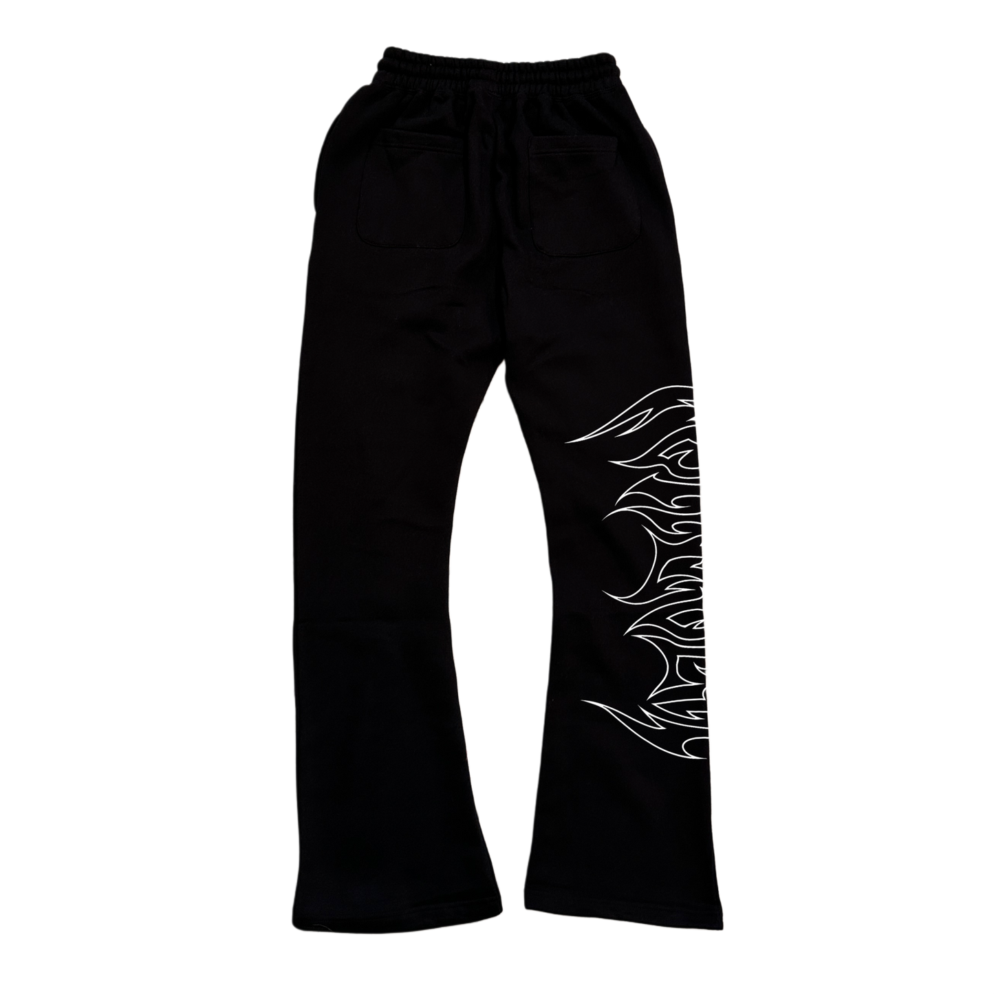 Back view of black stacked sweatpants with white outlined tribal lettering reading “forever” on the right side 