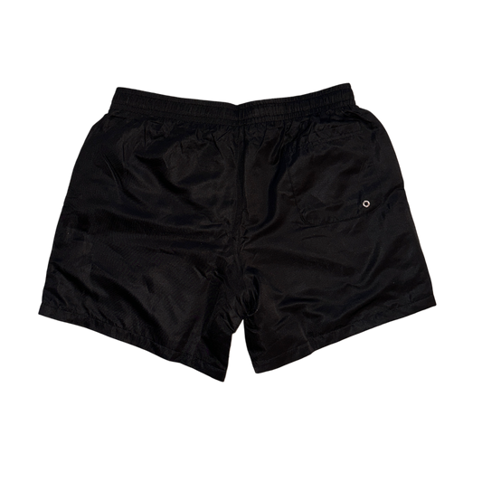 Back view of plain black trunks with white drawstrings 