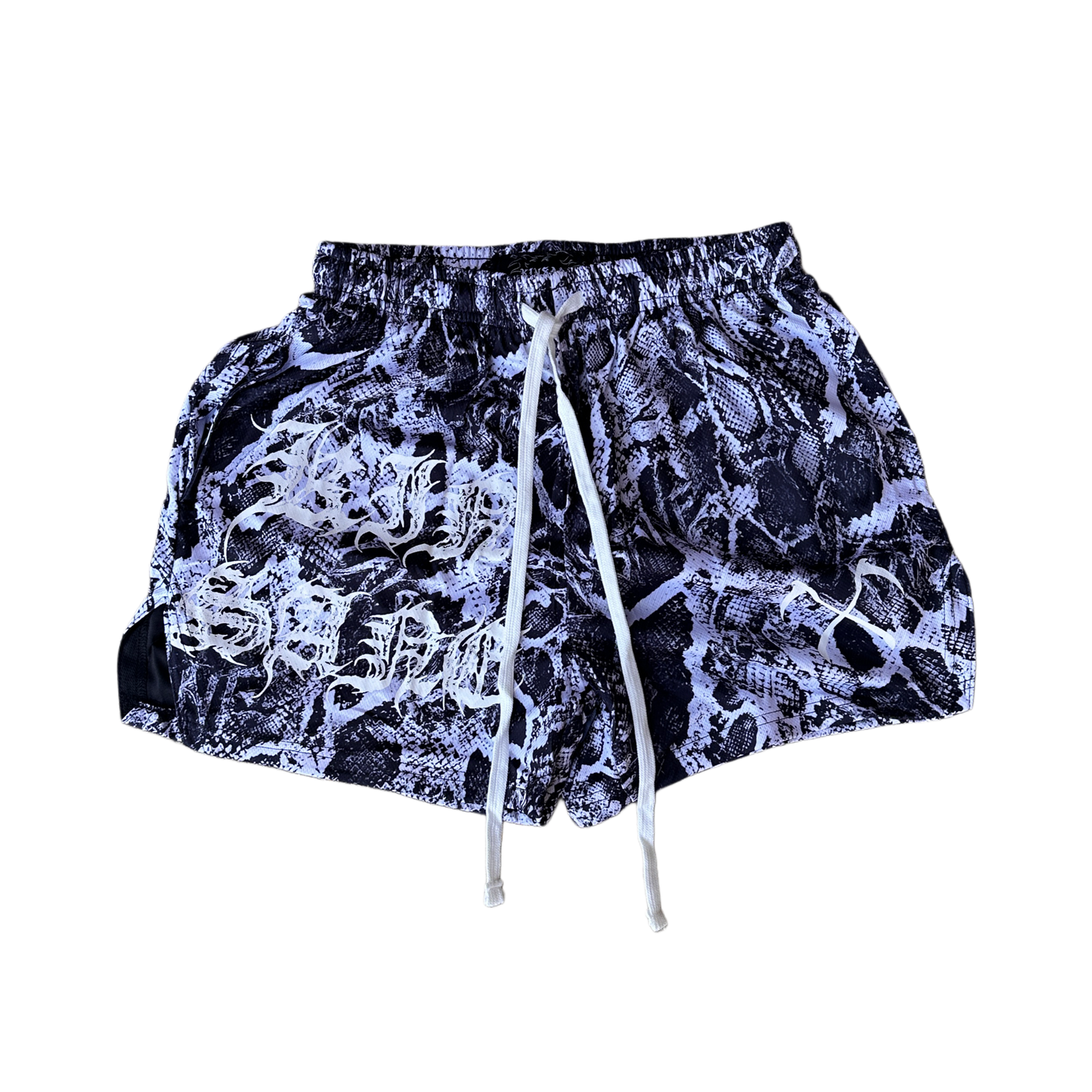 White and black snakeskin pattern athletic shorts with white drawstrings and white lettering on the right leg reading “KINSANE” and one white logo on the left leg 