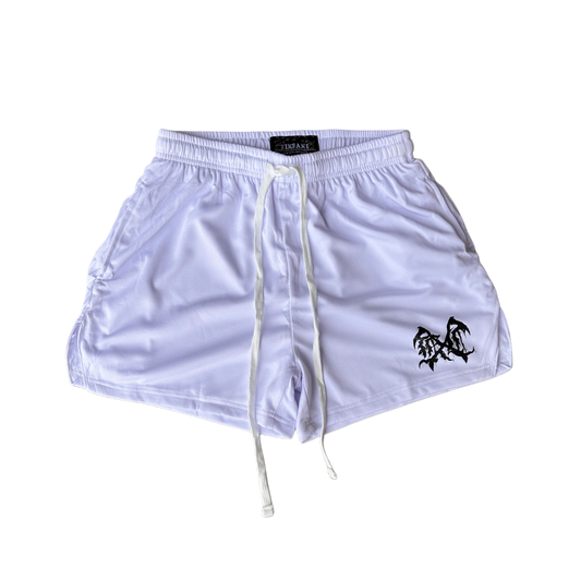 White athletic shorts with white drawstrings and a black logo on the left leg 