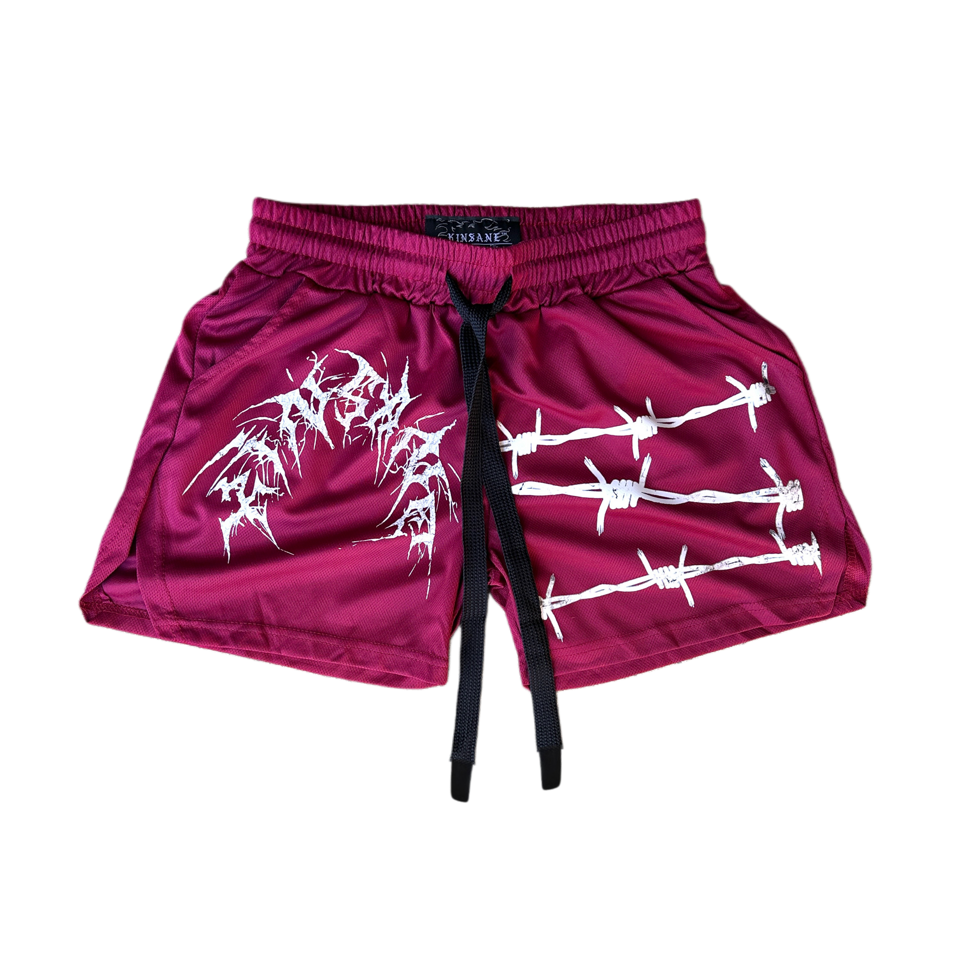 Dark red athletic shorts with elastic waistband and black drawstrings and white tribal lettering reading “KINSANE” on the right leg and white barbed wire design on the left leg 