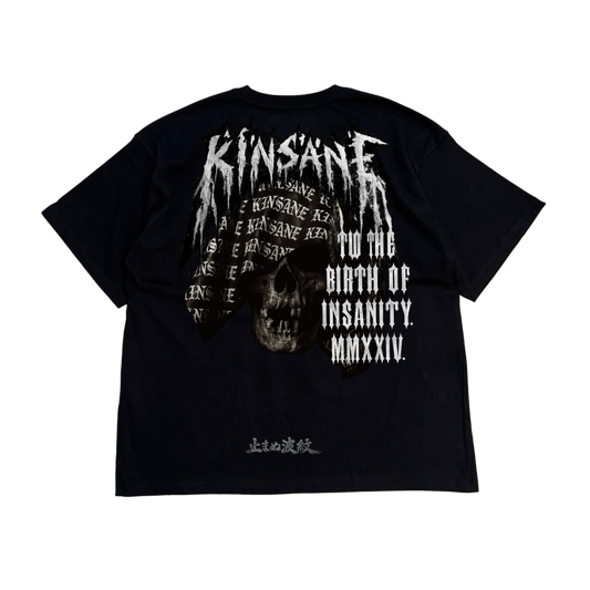 Back view of a black T-shirt with a black and white skull design with white lettering at the top reading “KINSANE” and white text on the right side reading “TO THE BIRTH OF INSANITY. MMXXIV” with text at the bottom in Japanese translating to “THE RIPPLE THAT CANNOT BE STOPPED” 