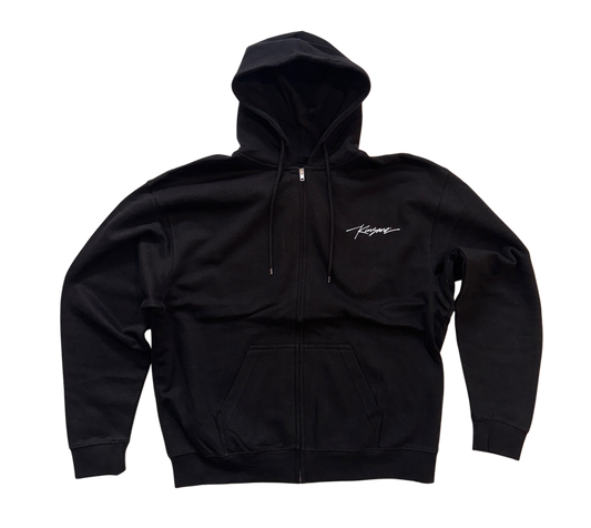 Black zip up hoodie with small white cursive text on the right side reading “Kinsane ®️”