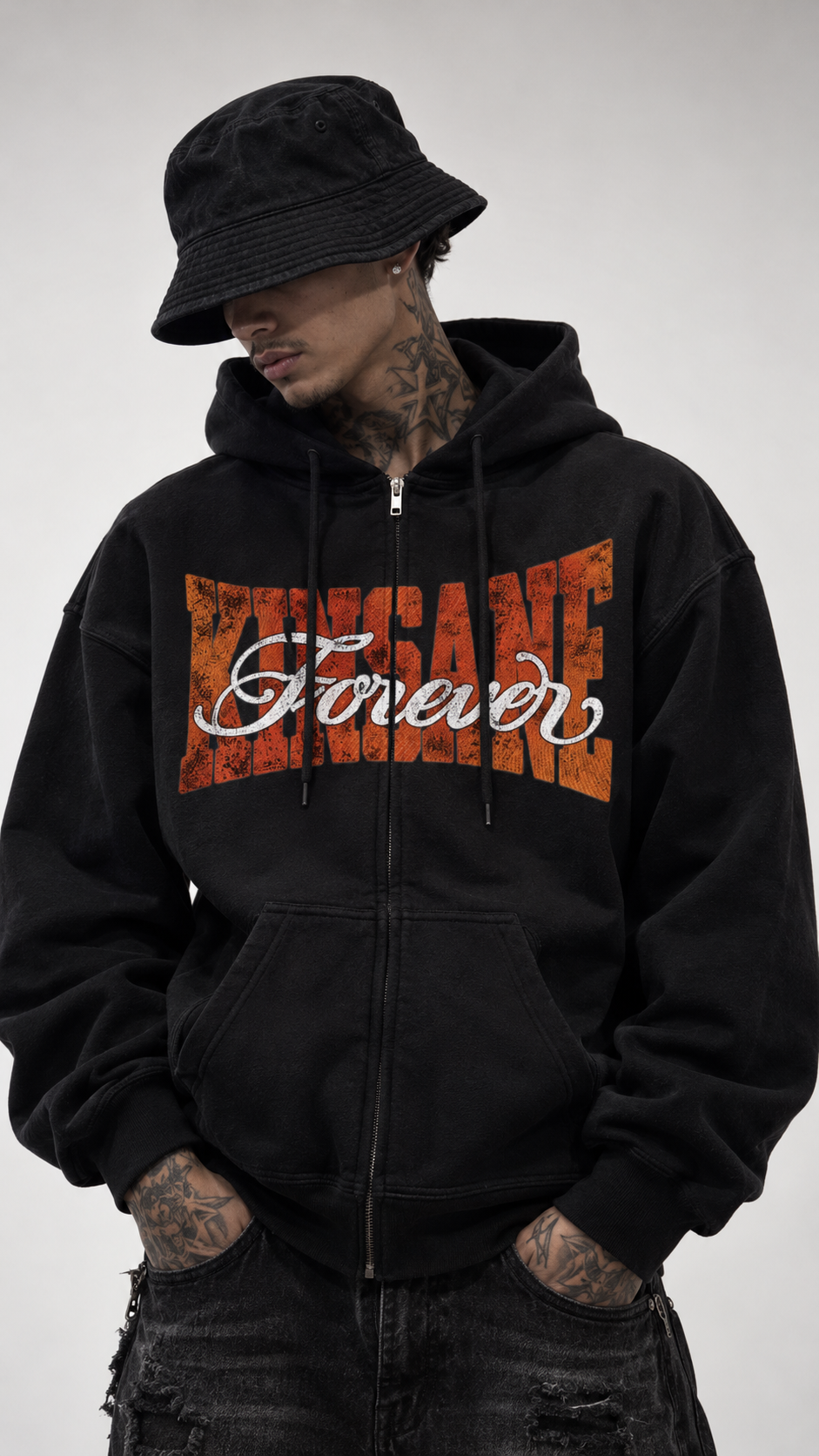 Man wearing Black zip up hoodie with orange text reading KINSANE across the chest and white cursive text on top reading “forever” 
