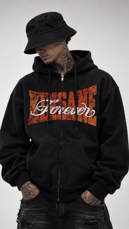 Man wearing Black zip up hoodie with orange text reading KINSANE across the chest and white cursive text on top reading “forever” 