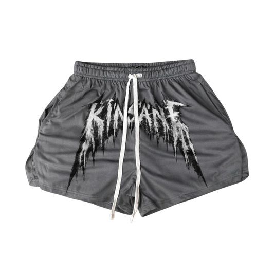 Grey athletic shorts with white drawstrings and white lettering across the middle reading “KINSANE” 