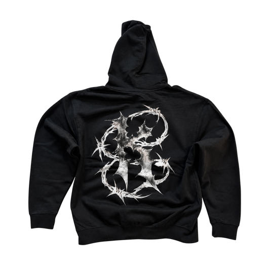 Back view of a black hoodie with white barbed wire “K” design 