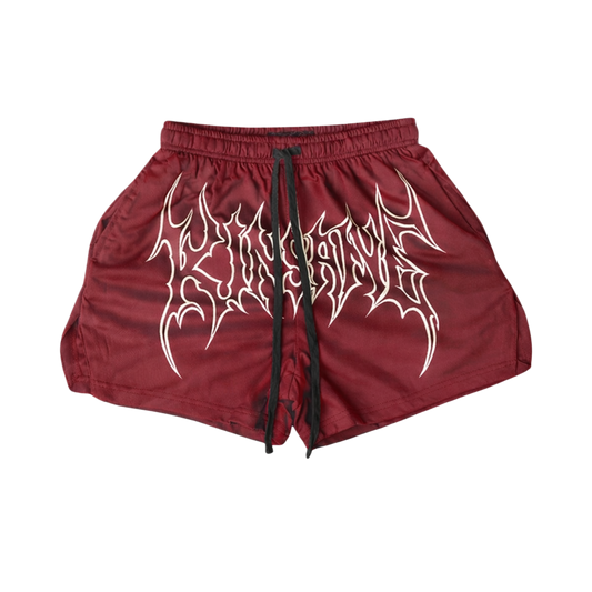 Maroon athletic shorts with black drawstrings and white outlined lettering across the front reading “KINSANE” 