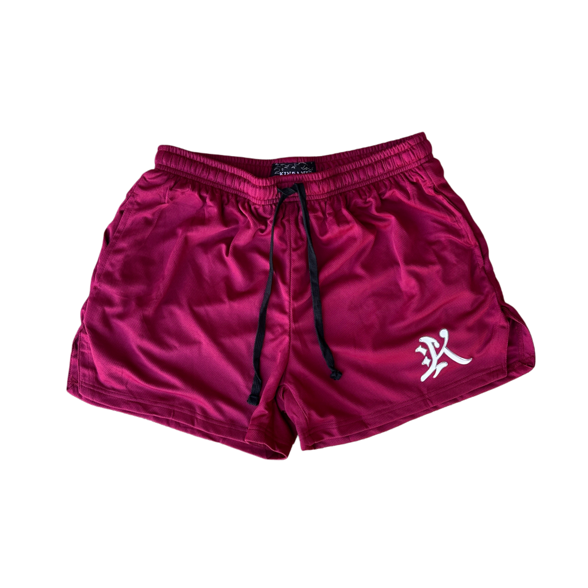 Maroon athletic shorts with black drawstrings and a white logo of the letter “K” on the left leg 