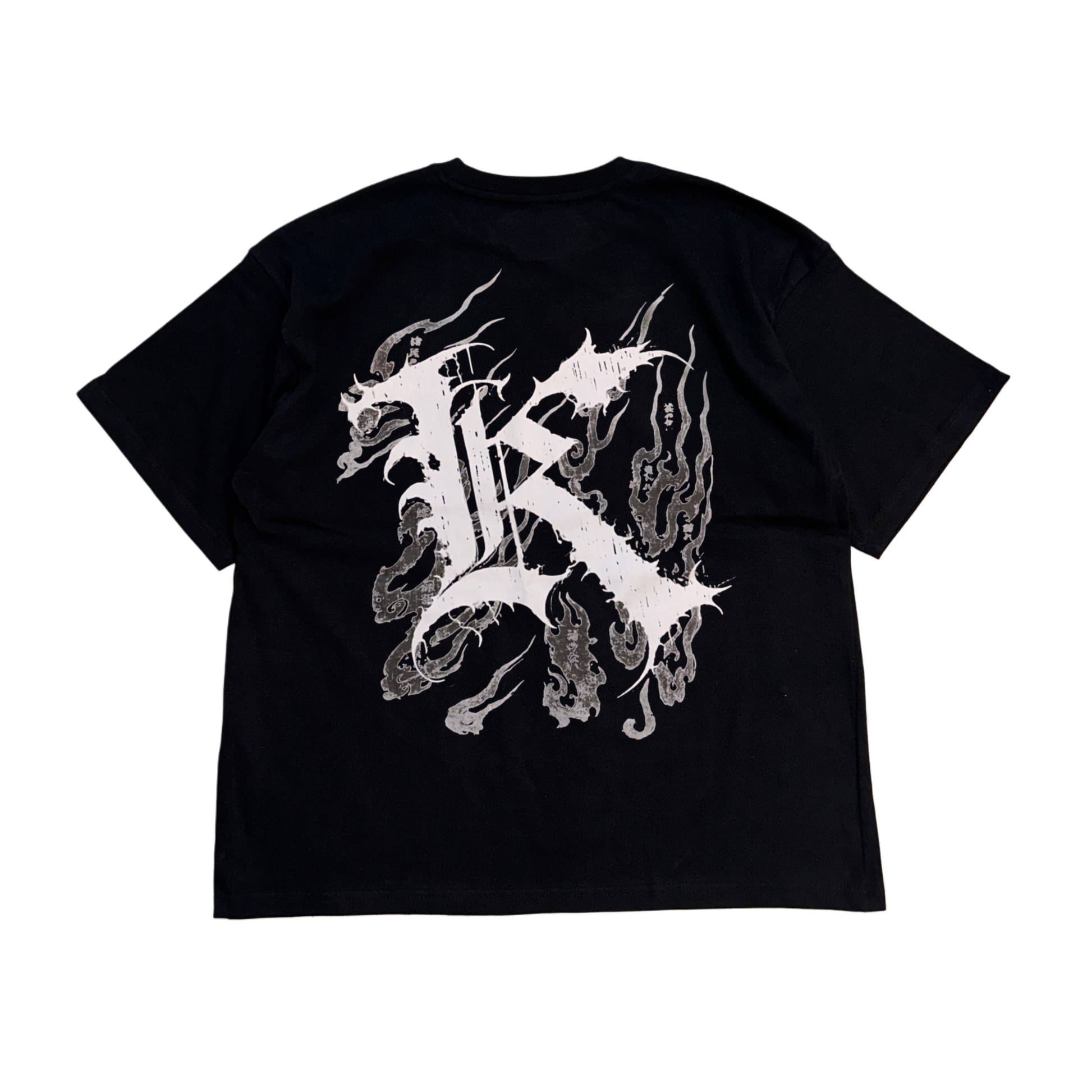 Back view of a black T-shirt with a white logo displaying white Japanese style flames and a white letter “K” and various Japanese text 