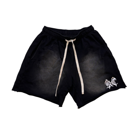Black acid washed shorts with white drawstrings and white logo on the left leg 