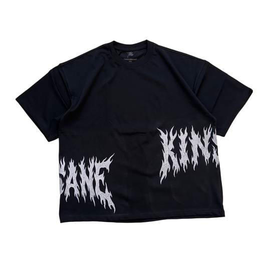 Black T-shirt with white flamed lettering on the sides reading “KIN” and “SANE” 
