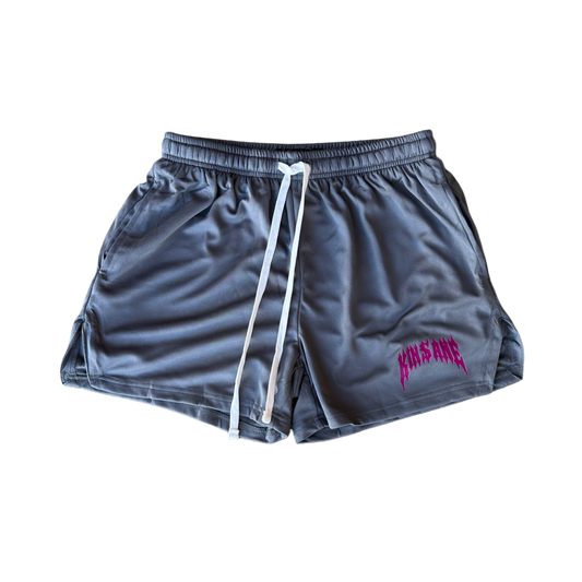 Grey athletic shorts with white drawstrings and red text reading “KINSANE” on the left leg 