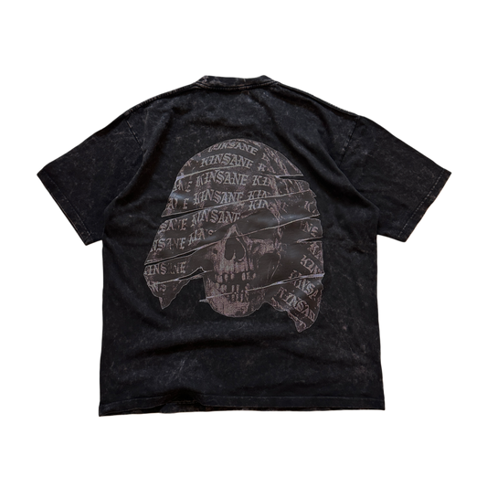 Back view of a black acid washed T-shirt with a black and grey skull design with white lettering reading “KINSANE” 