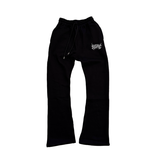 Black stacked sweatpants with white lettering reading “KINSANE” on the left leg 